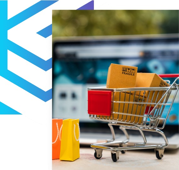 Playful image of shopping cart with parcels in front of a laptop